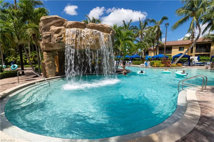 Community pool featuring a patio