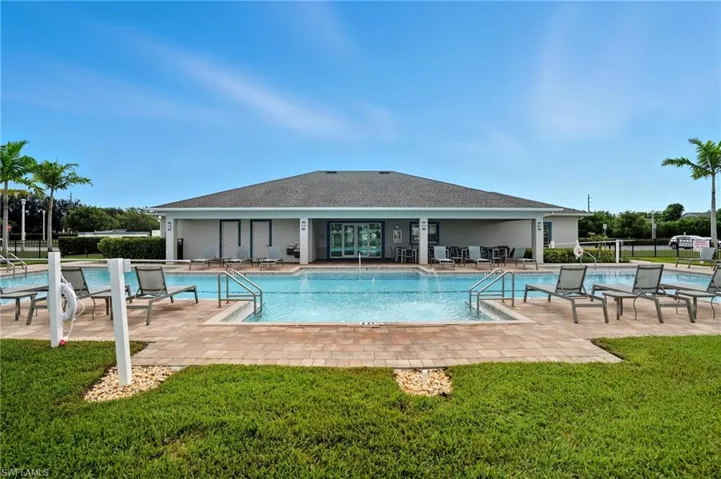 Community pool with a patio area