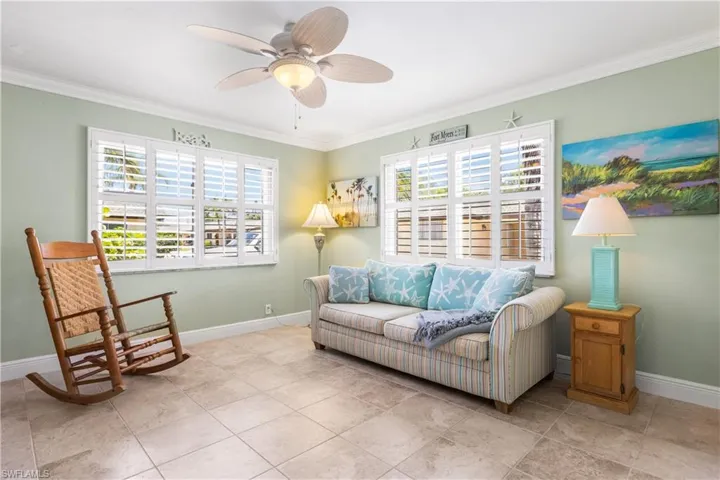 Tiled living room with crown molding