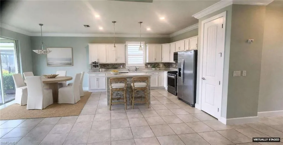 Dining Area and Breakfast bar. Tile. Pendant lights.