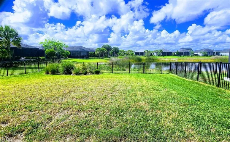 Fenced Lakefront backyard.
