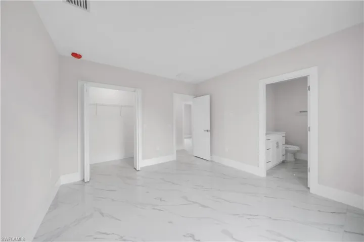 White porcelain tile flooring with subtle gray veining