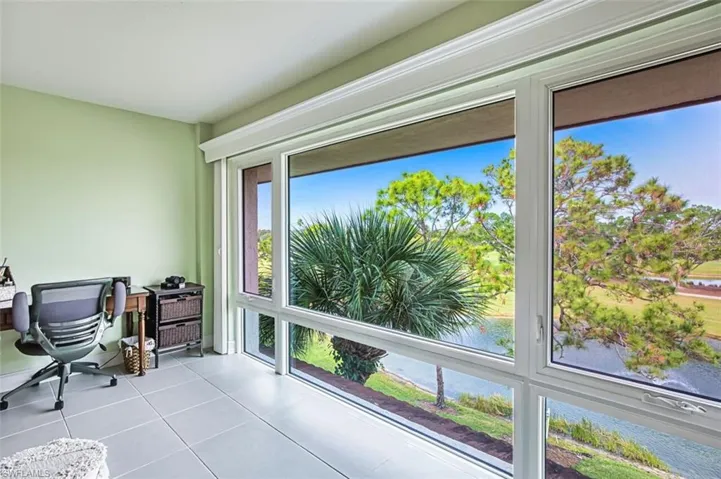 Sunroom / solarium with a water view