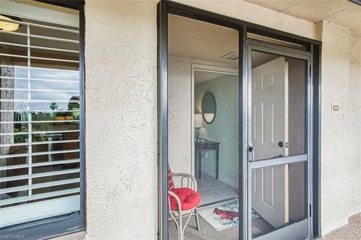 Property entrance with stucco siding