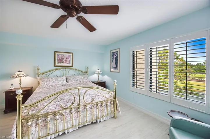 Bedroom featuring ceiling fan and wood finished floors