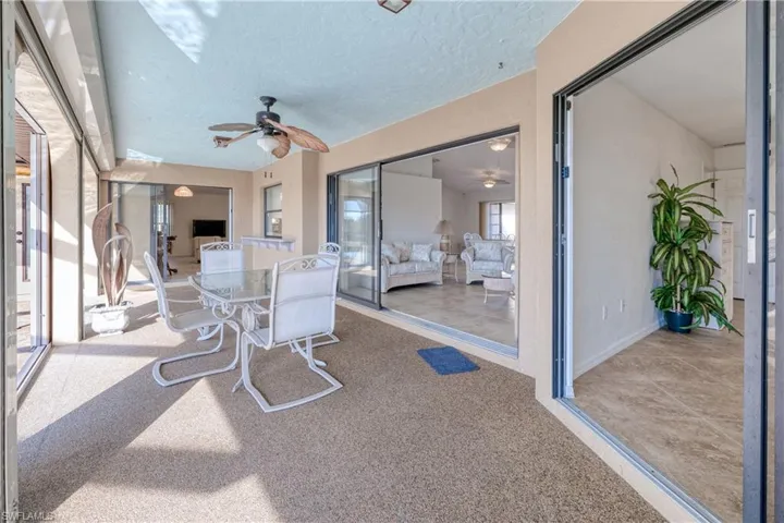 Sunroom featuring ceiling fan