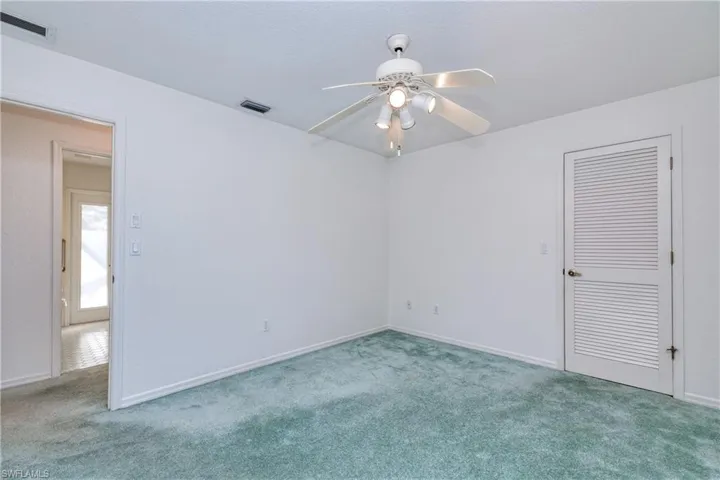 Unfurnished room with carpet flooring