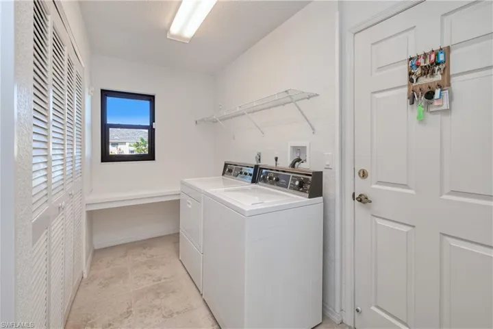 Laundry room featuring washer and clothes dryer