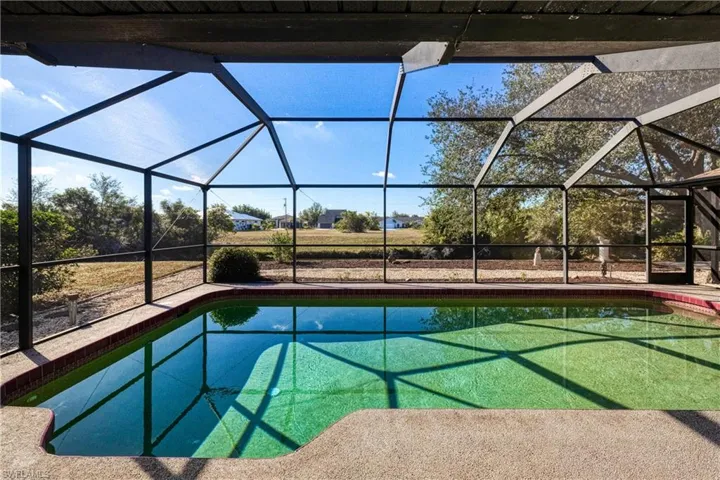 View of pool with a lanai
