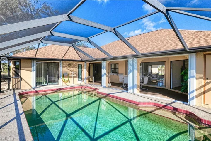 View of pool featuring a patio area and a lanai