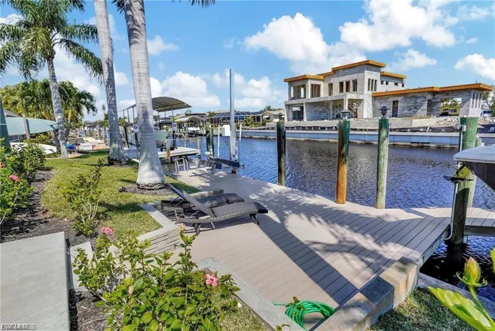 Dock area with a water view and boat lift
