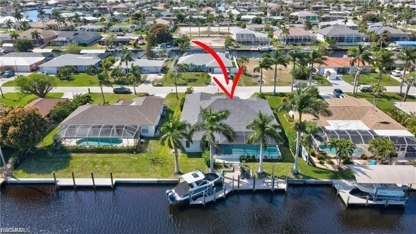 Aerial view of residential area featuring a large body of water