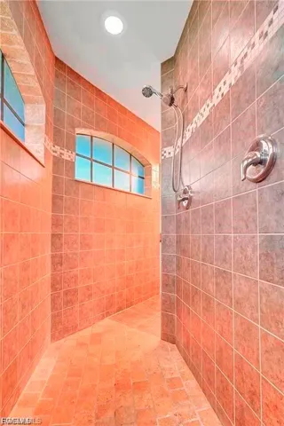 Bathroom featuring a tile shower