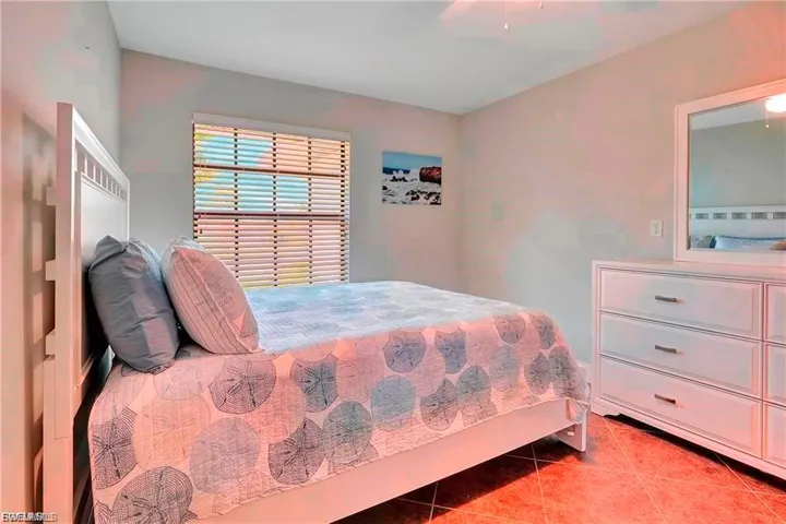 Bedroom featuring tile patterned floors and ceiling fan