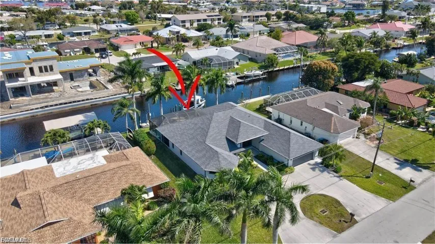 Aerial perspective of suburban area with a nearby body of water