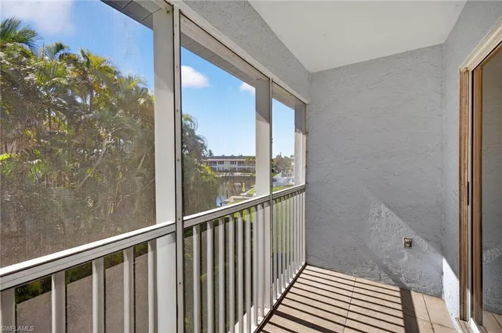 Balcony featuring a sunroom