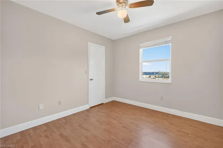 Unfurnished room with light wood-type flooring and a ceiling fan
