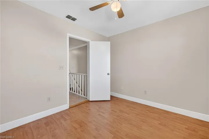 Spare room featuring light wood-type flooring and ceiling fan