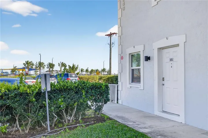 Property entrance with stucco siding
