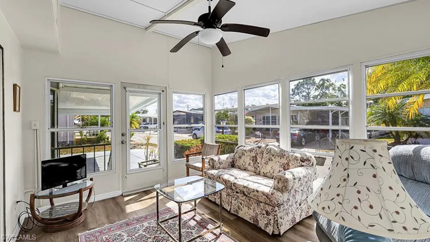 Sunroom featuring wood finished floors