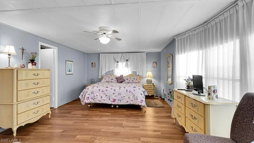 Bedroom featuring light wood-type flooring and a ceiling fan