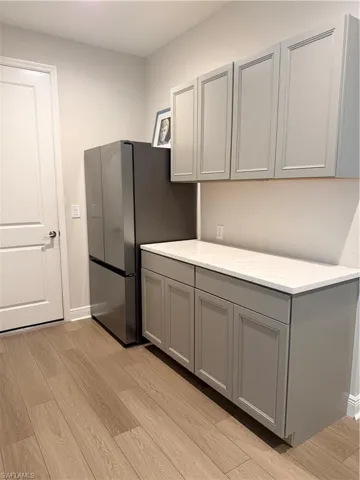 Entry off garage near guest bedrooms and bathroom