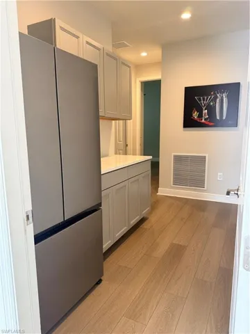 Entry off garage near guest bedrooms and bathroom