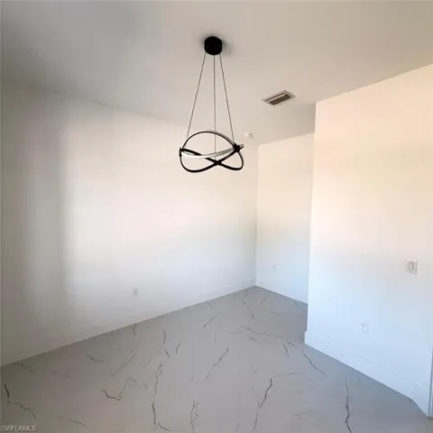 Empty room with baseboards and light marble finish flooring