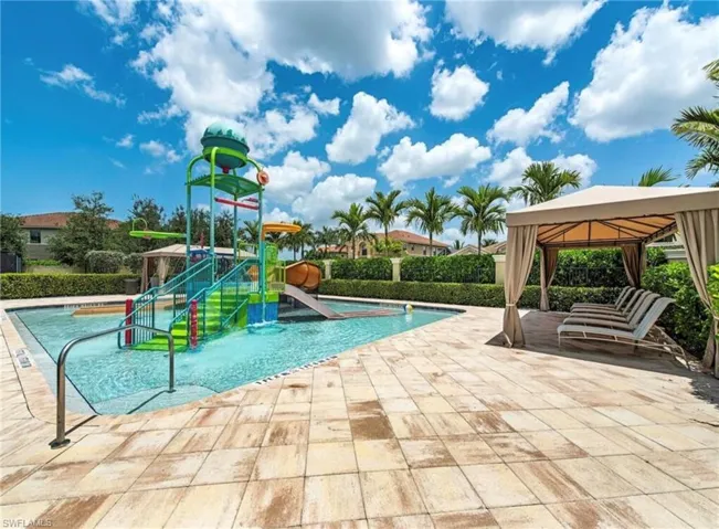 Community playground featuring a gazebo, a community pool, a patio, and a water play area