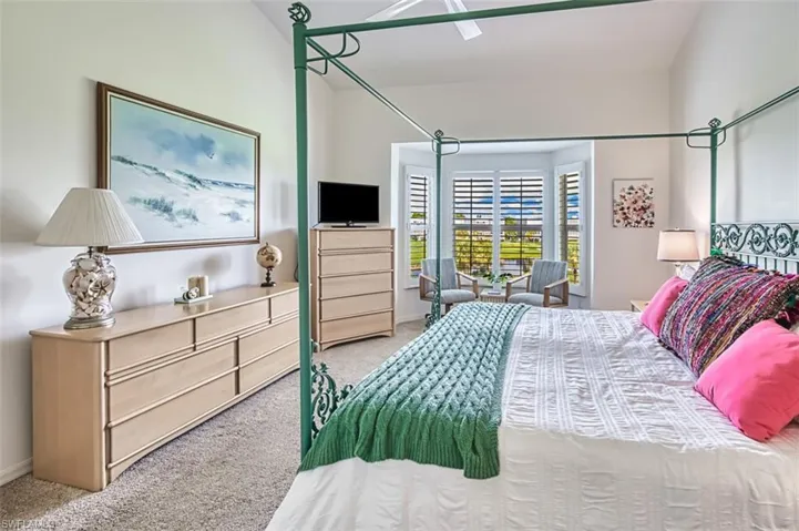 Bedroom with carpet flooring and baseboards
