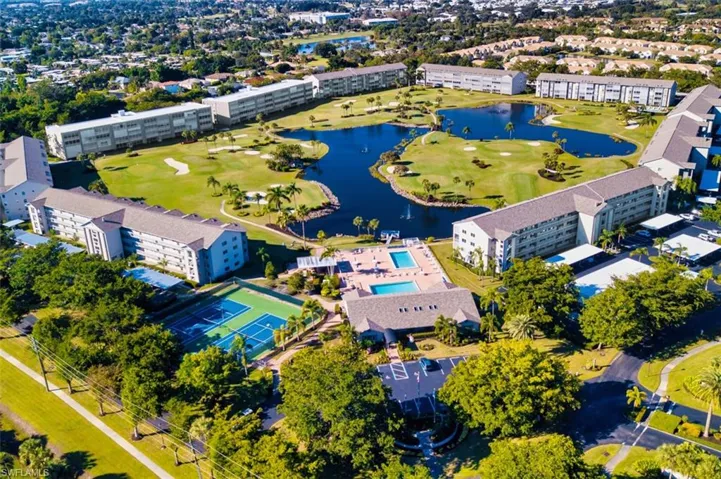 Drone / aerial view of a golf club and a nearby body of water