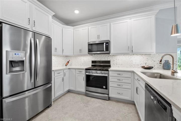 White cabinets, stainless appliances