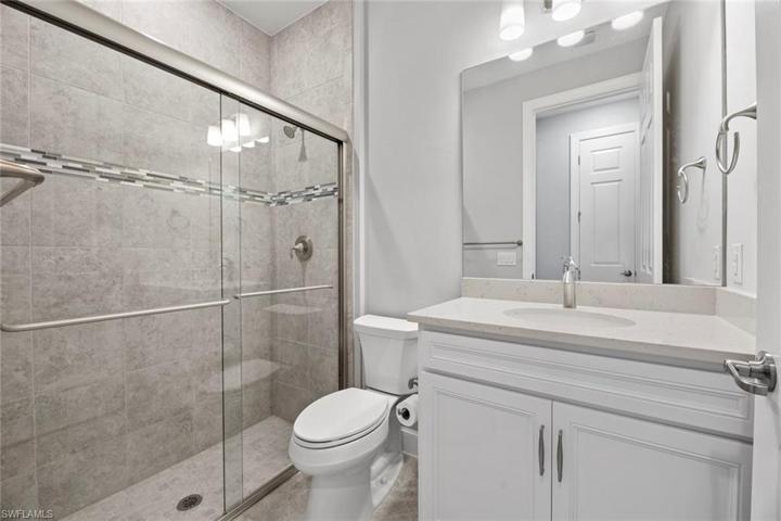 Guest bath with Quartz counter top, large step-in shower