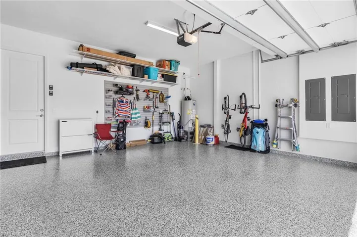 Luxury Garage with Epoxy Floor and custom shelving and storage in your 3 car garage