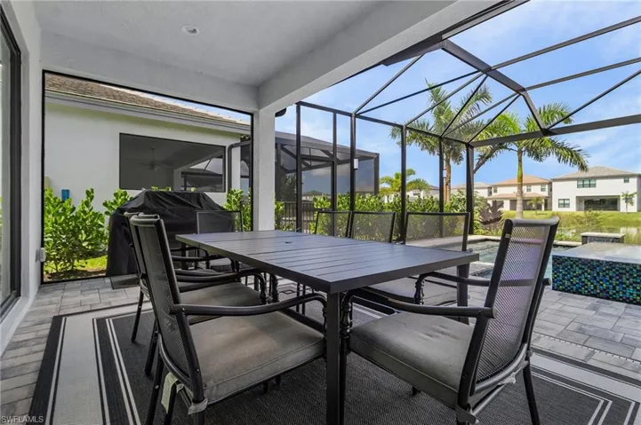 Covered Lanai with ceiling fan and recessed lights showing lake view