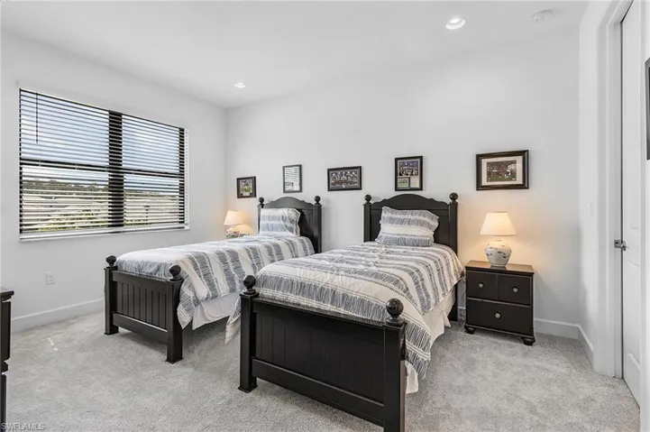 Guest Bedroom with carpet floors, ensuite full bath, walk in closet and recessed lighting