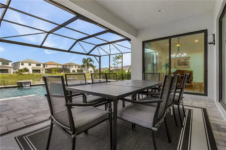 Covered Lanai with ceiling fan and recessed lights showing lake view