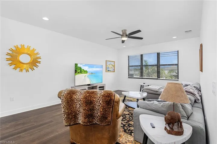 Loft featuring ceiling fan, recessed lighting, dark wood finished floors