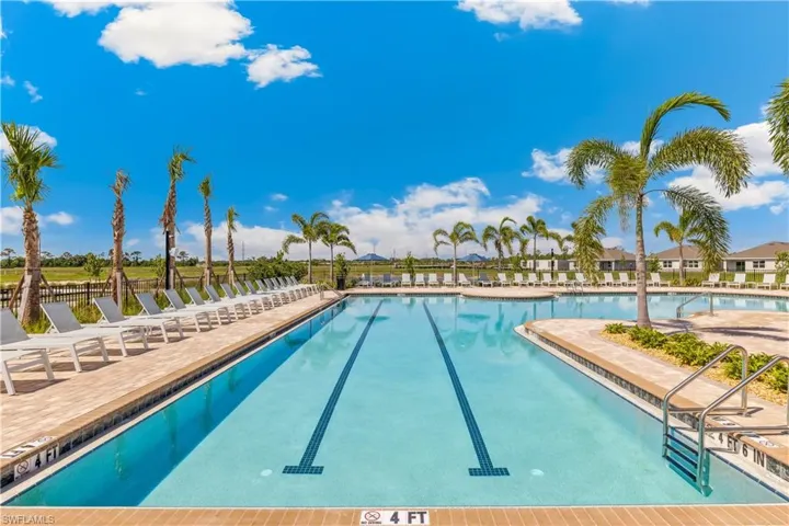 Community pool featuring a patio