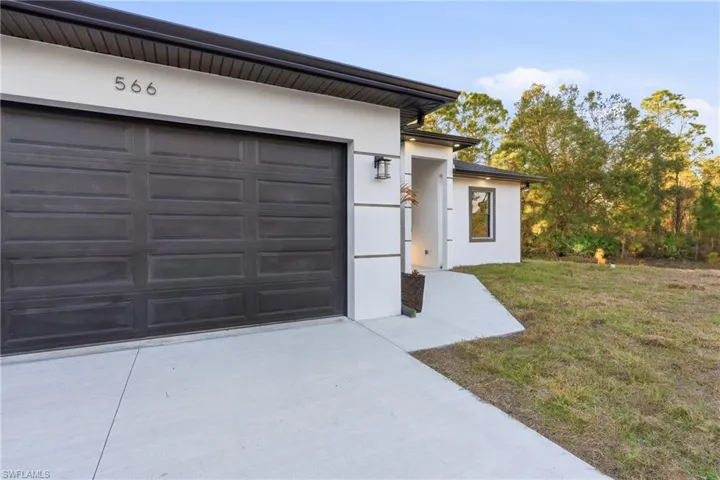 Garage with concrete driveway