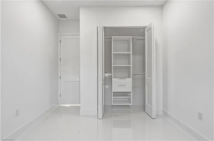 Unfurnished bedroom with baseboards