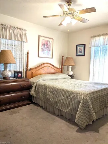 Bedroom featuring carpet floors and ceiling fan