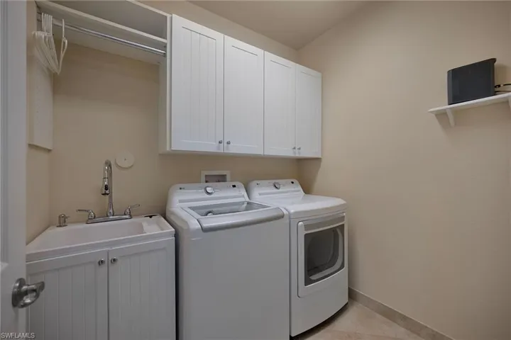 2ND FLOOR LAUNDRY WITH SINK AND CABINETS.