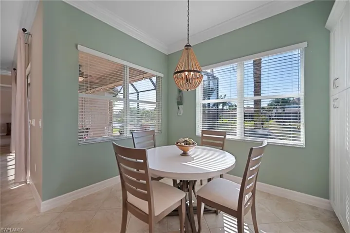 THE VIEW OF THE LAKE MAKES THIS A WARM AND COZY BREAKFAST AREA.