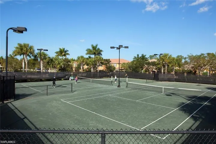 RESIDENTS ENJOYING OUR TWO NEW HAR-TRU TENNIS COURTS.