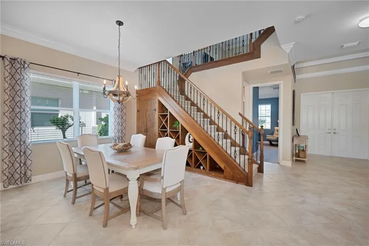 FORMAL DINING ROOM WITH STORAGE AND WINE RACKS.