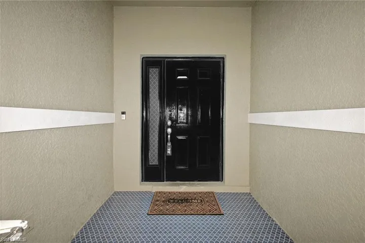 Beautiful tile on screened enclosed entrance.