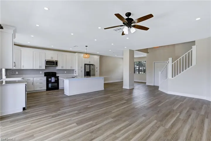 Open concept floorplan and recessed lighting.