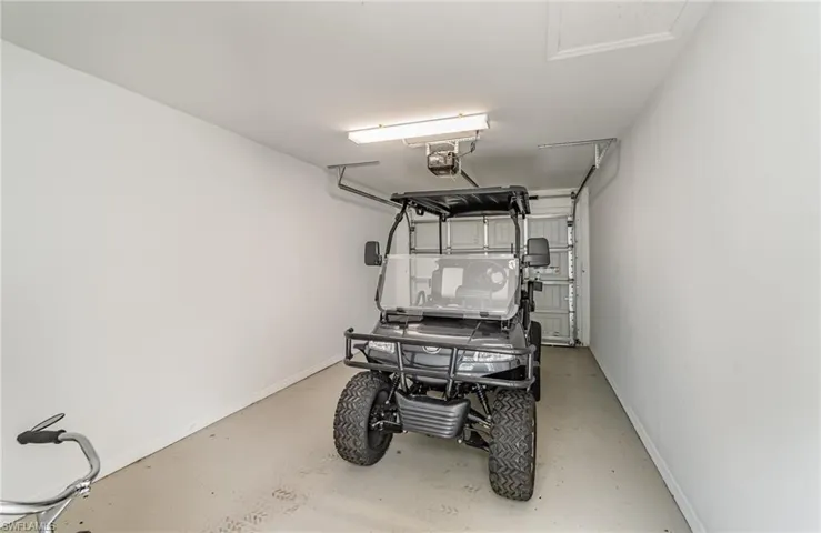 Garage featuring a garage door opener