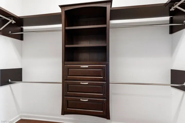 Spacious closet featuring wood finished floors